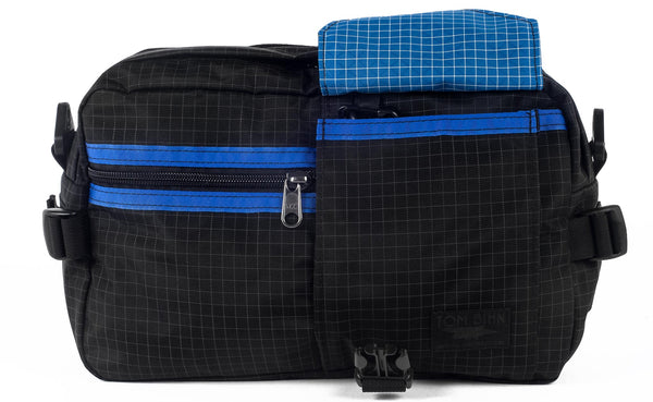 The LGD in Black Halcyon/Royal/Island. Front view, front buckle pocket lifted up to show the Island lining.